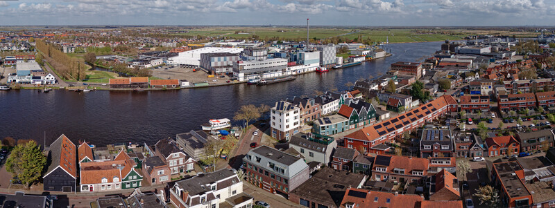 Wormer Netherlands 10 April 2026 Aerial view of the Olam International Cacoa factory De Moriaan along the river juxtaposed with quaint red roofed houses. Wormer Netherlands 10 April 2026 Aerial view of the Olam International Cacoa factory De Moriaan along the river juxtaposed with quaint red roofed houses.