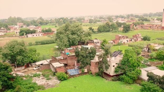 Aerial view of solar panels on rural rooftops in Lucknow India.