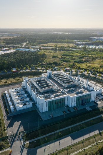 Aerial view of Vantage Data Centers BER1 facility featuring modern architecture rooftop cooling units and surrounding industrial landscape in Ludwigsfelde Brandenburg Germany. Aerial view of Vantage Data Centers BER1 facility featuring modern architecture rooftop cooling units and surrounding industrial landscape in Ludwigsfelde Brandenburg Germany.
