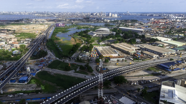 Aerial view of the Wole Soyinka Centre for Culture and Creative Arts National Theatre Nigeria surrounded by highways and urban landscape in Lagos Lagos Nigeria. Aerial view of the Wole Soyinka Centre for Culture and Creative Arts National Theatre Nigeria surrounded by highways and urban landscape in Lagos Lagos Nigeria.