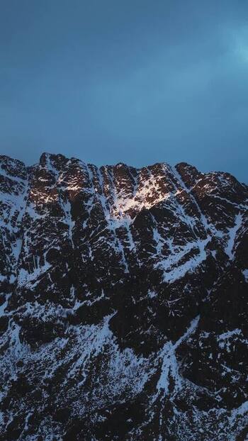 Aerial view of snow covered mountain peaks Norway.