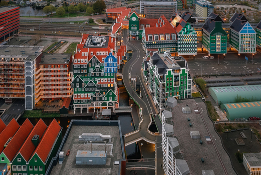 Zaandam Netherlands 26 April 2022 Aerial view of the Inntel Hotels Amsterdam Zaandam featuring its unique stacked house architecture and surrounding urban landscape.