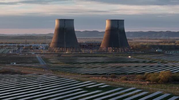 Aerial view of solar park with towers Italy.