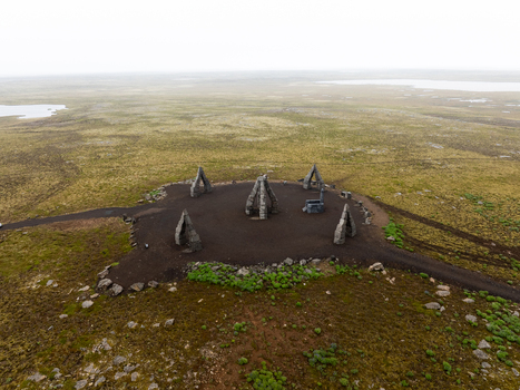 Aerial view of Arctic Henge a modern stone monument with towering basalt structures set in the vast mossy landscape of Raufarhofn Nordurthing Iceland.