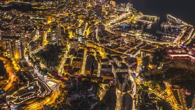 Aerial view of the illuminated cityscape of Monaco Monaco.