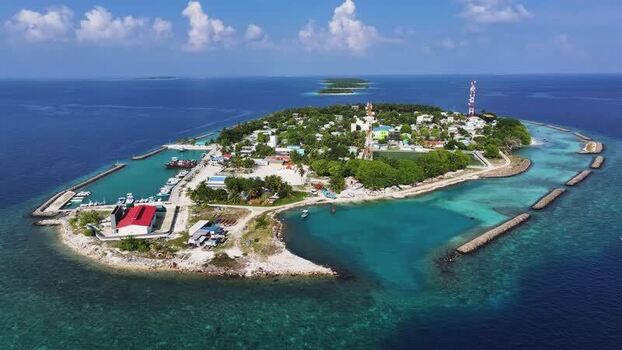 Aerial view of Kendhoo island and its harbor Maldives. Aerial view of Kendhoo island and its harbor Maldives.
