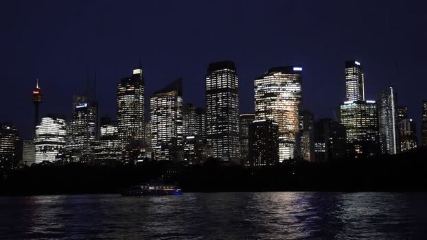 View of the illuminated Sydney skyline at night Australia.