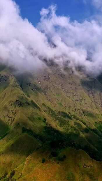 Aerial view of lush green mountain slopes in Bali Indonesia.