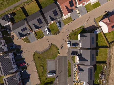 Linlithgow United Kingdom 29 April 2026 Aerial view of a modern residential housing estate with solar panels on rooftops parked cars and paved streets in Linlithgow. Linlithgow United Kingdom 29 April 2026 Aerial view of a modern residential housing estate with solar panels on rooftops parked cars and paved streets in Linlithgow.