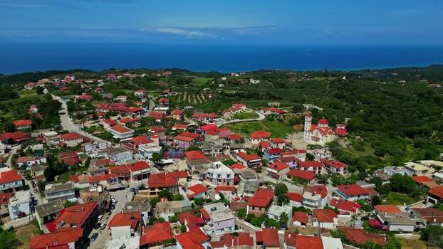 Aerial view of a village with a church in Greece.