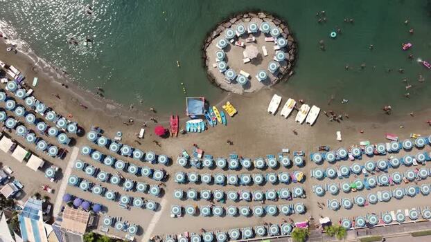 Aerial view of a beach with umbrellas and swimmers Italy. Aerial view of a beach with umbrellas and swimmers Italy.