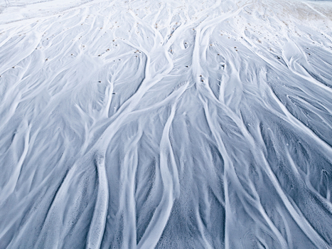 Aerial view of the intricate braided river patterns of a glacial delta in Iceland. Aerial view of the intricate braided river patterns of a glacial delta in Iceland.