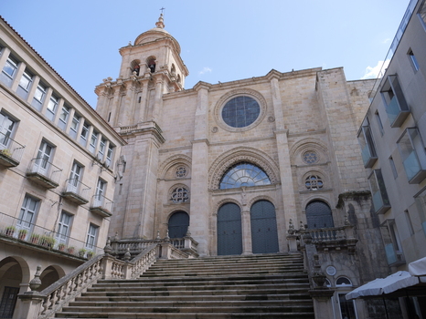 View of the historic Catedral de Ourense with its ornate stone facade bell tower and grand staircase leading to the entrance situated in the city center of Ourense Ourense Spain. View of the historic Catedral de Ourense with its ornate stone facade bell tower and grand staircase leading to the entrance situated in the city center of Ourense Ourense Spain.