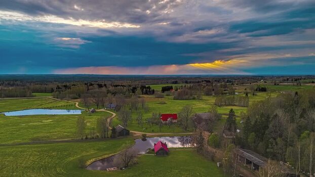 Aerial view of rural farmhouses and ponds in Latvia. Aerial view of rural farmhouses and ponds in Latvia.