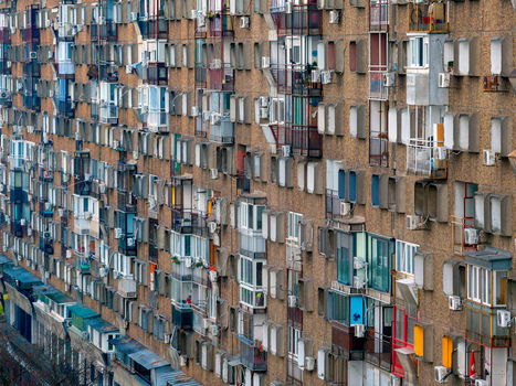 Aerial view of a dense residential apartment building facade featuring numerous balconies and air conditioning units in Belgrade City of Belgrade Serbia. Aerial view of a dense residential apartment building facade featuring numerous balconies and air conditioning units in Belgrade City of Belgrade Serbia.