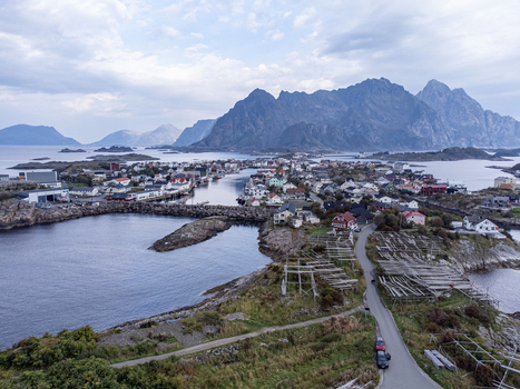Aerial view of a quaint fishing village nestled amidst the rugged Lofoten Islands with the sea reflecting the sky s muted tones Henningsvær Nordland Norway. Aerial view of a quaint fishing village nestled amidst the rugged Lofoten Islands with the sea reflecting the sky s muted tones Henningsvær Nordland Norway.