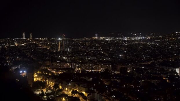 View of Barcelona city skyline at night with Sagrada Familia Spain.