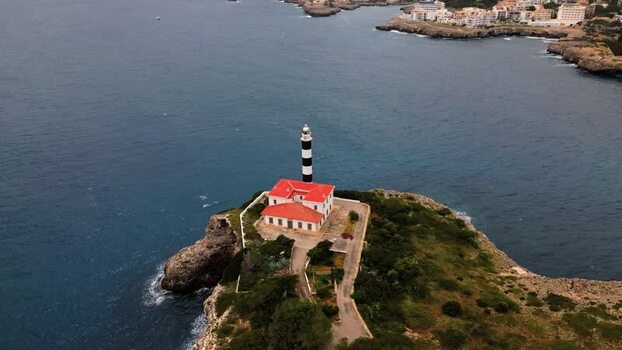 Aerial view of Far de Portocolom lighthouse on the coast Spain.