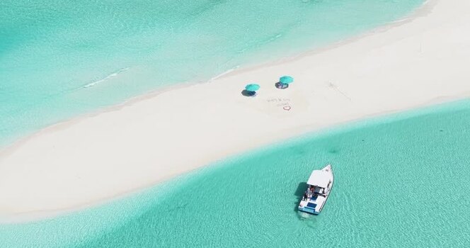Aerial view of a boat near a tropical sandbank Maldives. Aerial view of a boat near a tropical sandbank Maldives.
