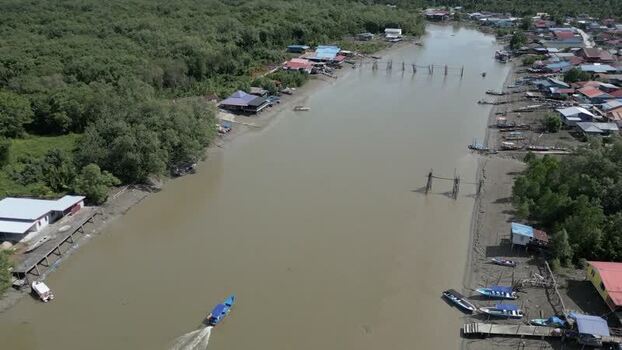 Aerial view of a riverine village with stilt houses Malaysia. Aerial view of a riverine village with stilt houses Malaysia.