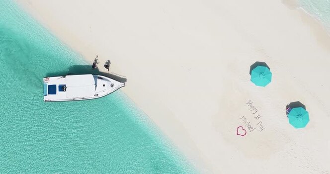 Aerial view of a boat on a white sand beach Maldives. Aerial view of a boat on a white sand beach Maldives.