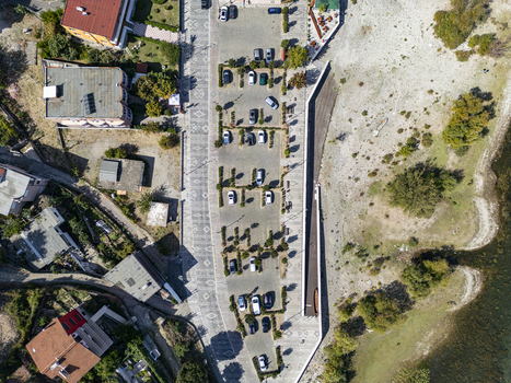 Aerial view of a parking lot situated along the shoreline of Lake Shkoder in Shiroke Qarku i Shkodres Albania. Aerial view of a parking lot situated along the shoreline of Lake Shkoder in Shiroke Qarku i Shkodres Albania.