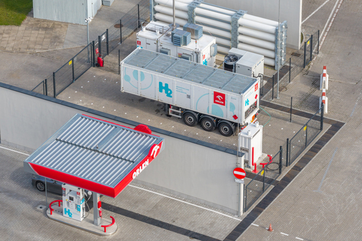 Plock Poland 10 September 2026 Aerial view of the Orlen hydrogen fuel station featuring a refueling pump and a mobile hydrogen storage trailer parked in a fenced facility. Plock Poland 10 September 2026 Aerial view of the Orlen hydrogen fuel station featuring a refueling pump and a mobile hydrogen storage trailer parked in a fenced facility.