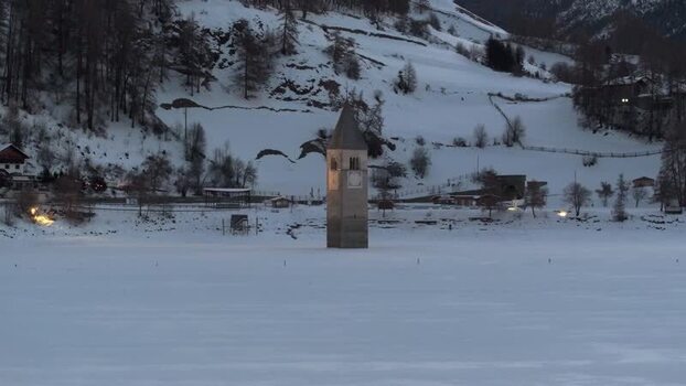 Aerial view of the sunken bell tower in Graun im Vinschgau Italy. Aerial view of the sunken bell tower in Graun im Vinschgau Italy.