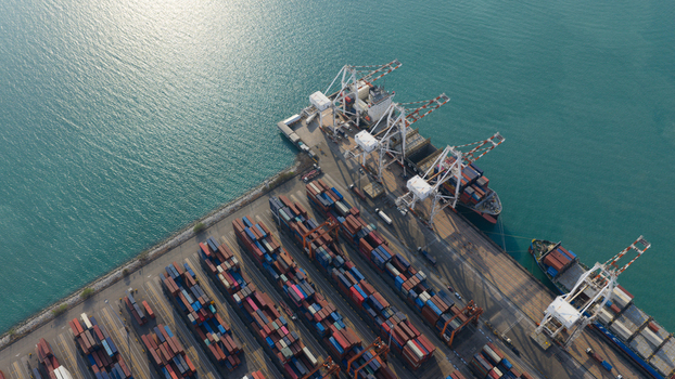 Si Racha District Thailand 08 March 2026 Aerial view of Laem Chabang International Terminal with cargo ships large cranes and stacked shipping containers by the turquoise sea. Si Racha District Thailand 08 March 2026 Aerial view of Laem Chabang International Terminal with cargo ships large cranes and stacked shipping containers by the turquoise sea.