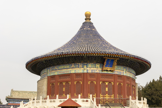 View of the Imperial Vault of Heaven featuring its iconic blue tiled roof and red wooden structure at the Temple of Heaven Beijing Beijing China. View of the Imperial Vault of Heaven featuring its iconic blue tiled roof and red wooden structure at the Temple of Heaven Beijing Beijing China.