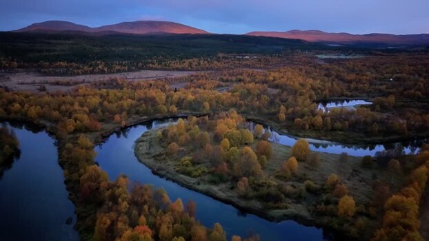 Aerial view of Ljusnan river at sunrise in Sweden.