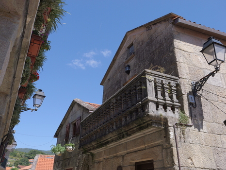 View of the historic stone architecture and traditional balcony in the village of Combarro Pontevedra Spain.
