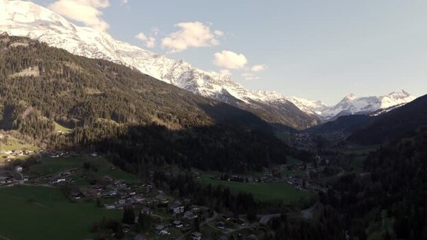 Aerial view of the alpine valley and snow capped mountains France.