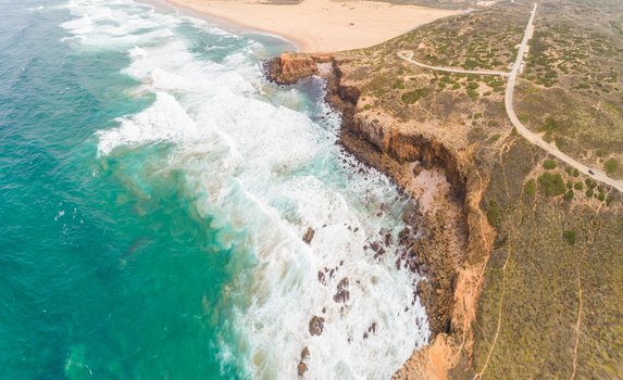 Aerial view of strong waves at Praia da Bordeira Carrapateira Portugal