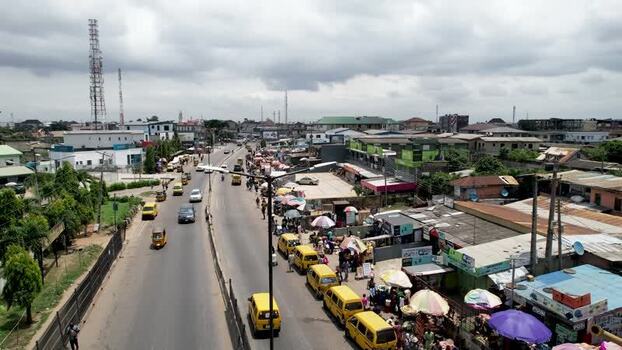 Aerial view of Ojodu Berger street and yellow minibuses Nigeria. Aerial view of Ojodu Berger street and yellow minibuses Nigeria.