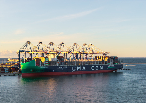 Gdansk Poland 23 September 2026 Aerial view of a CMA CGM container ship docked at the Baltic Hub container terminal with gantry cranes and calm waters at golden hour. Gdansk Poland 23 September 2026 Aerial view of a CMA CGM container ship docked at the Baltic Hub container terminal with gantry cranes and calm waters at golden hour.