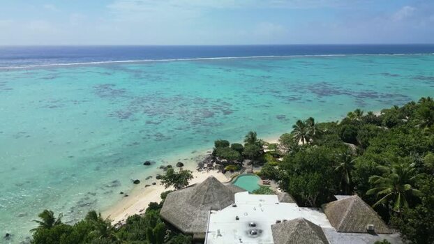 Aerial view of a tropical resort and turquoise lagoon Cook Islands. Aerial view of a tropical resort and turquoise lagoon Cook Islands.