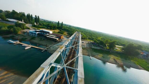 Aerial FPV view of a railway bridge over a river Serbia. Aerial FPV view of a railway bridge over a river Serbia.
