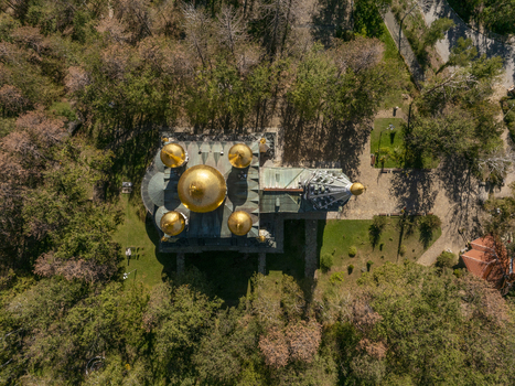 Aerial view of Shipka Memorial Church with its distinctive golden domes surrounded by lush green trees and forest in Shipka Stara Zagora Bulgaria. Aerial view of Shipka Memorial Church with its distinctive golden domes surrounded by lush green trees and forest in Shipka Stara Zagora Bulgaria.