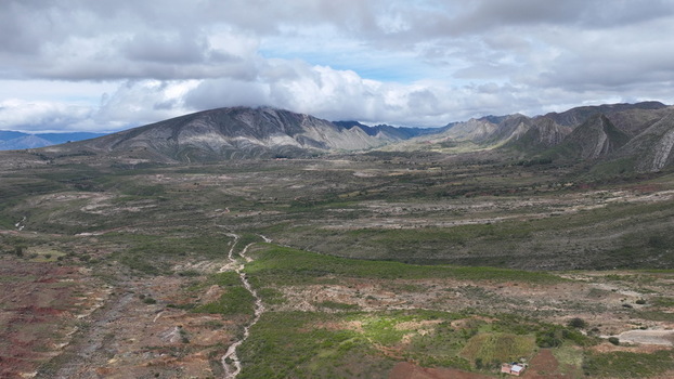 Aerial view of the rugged landscape of Torotoro with dramatic mountain ranges arid terrain and cloudy skies Torotoro Potosi Department Bolivia. Aerial view of the rugged landscape of Torotoro with dramatic mountain ranges arid terrain and cloudy skies Torotoro Potosi Department Bolivia.