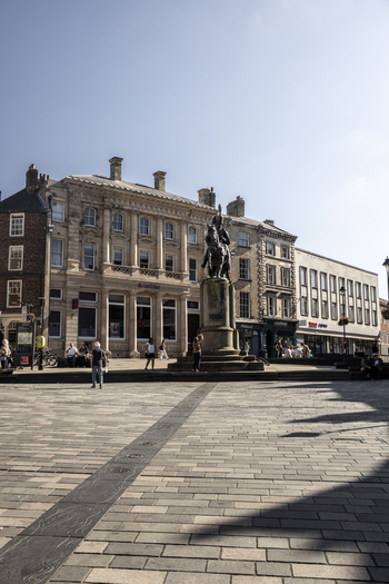Durham United Kingdom 13 July 2026 View of the Market Place in Durham featuring the equestrian statue of the 3rd Marquess of Londonderry historic stone buildings and people walking. Durham United Kingdom 13 July 2026 View of the Market Place in Durham featuring the equestrian statue of the 3rd Marquess of Londonderry historic stone buildings and people walking.