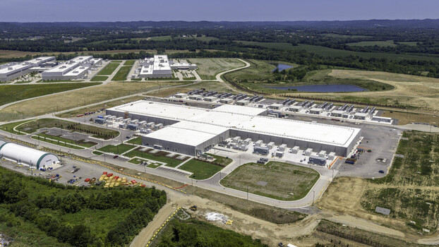 Aerial view of the Meta Data Center complex featuring large industrial buildings cooling units and surrounding green landscape in Gallatin Tennessee United States. Aerial view of the Meta Data Center complex featuring large industrial buildings cooling units and surrounding green landscape in Gallatin Tennessee United States.