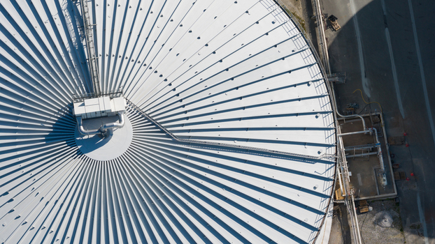 Aerial view of the circular roof of the Cosun Beet Company facility with radial metal panels industrial piping and maintenance walkways in Groningen Groningen Netherlands. Aerial view of the circular roof of the Cosun Beet Company facility with radial metal panels industrial piping and maintenance walkways in Groningen Groningen Netherlands.
