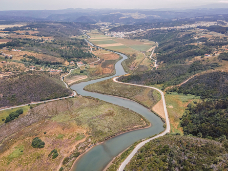 Aerial view of Praia de Odeceixe along Ribeira de Seixe river Odeceixe Faro Portugal.