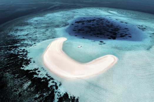 Aerial view of a boat docked near the South Ari Atoll Maldives.