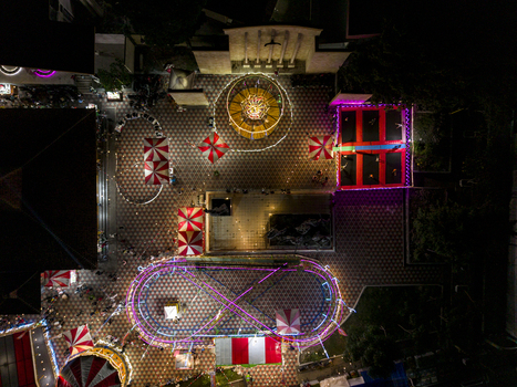 Aerial view of the GOR Gelarsena Klaten Night Market with illuminated rides and colorful tents at night in Kecamatan Klaten Utara Jawa Tengah Indonesia. Aerial view of the GOR Gelarsena Klaten Night Market with illuminated rides and colorful tents at night in Kecamatan Klaten Utara Jawa Tengah Indonesia.