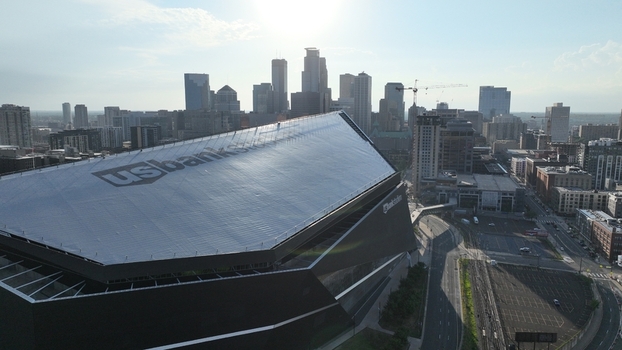 Aerial view of the U.S. Bank Stadium a modern architectural marvel stands prominently against the city skyline Minneapolis United States.