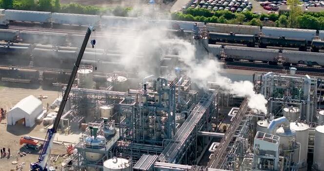 Aerial view of an industrial chemical plant with steam United States. Aerial view of an industrial chemical plant with steam United States.