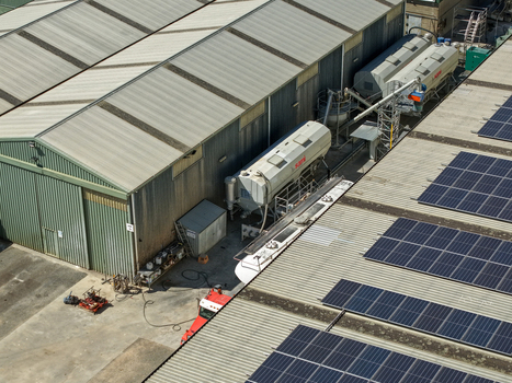 Kilsyth Victoria Australia 20 September 2026 Aerial view of industrial facilities featuring large storage tanks solar panels on the roof and corrugated metal structures. Kilsyth Victoria Australia 20 September 2026 Aerial view of industrial facilities featuring large storage tanks solar panels on the roof and corrugated metal structures.