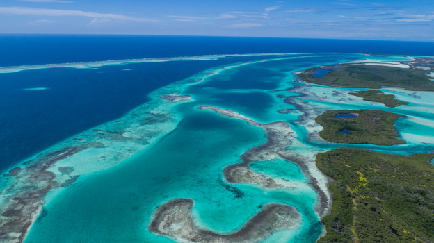 Aerial view of Los Roques archipelago featuring turquoise waters coral reefs and small islands in Los Roques Dependencias Federales Venezuela. Aerial view of Los Roques archipelago featuring turquoise waters coral reefs and small islands in Los Roques Dependencias Federales Venezuela.